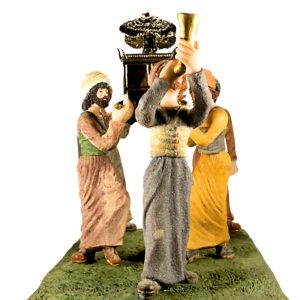a statue of the ark of the covenant being carried by levites