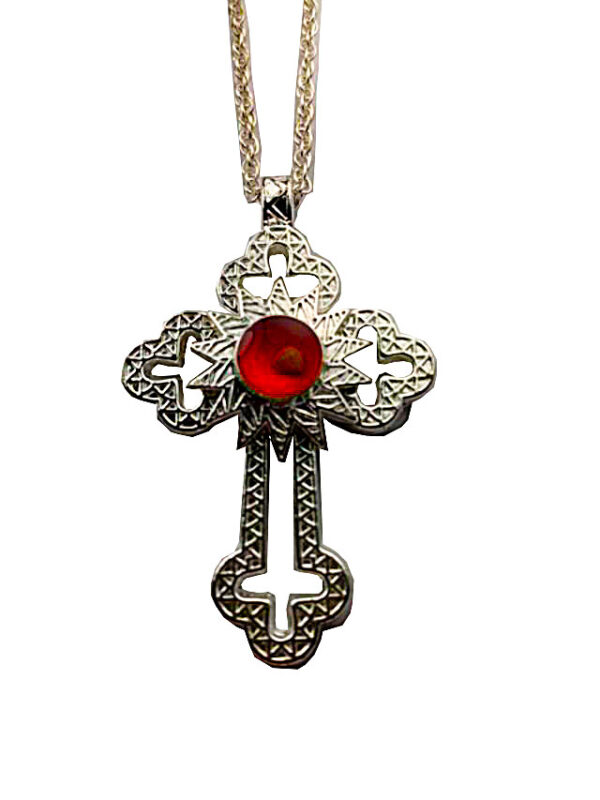 a cross with a red stone