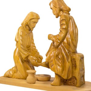 carved figures of Jesus washing feet