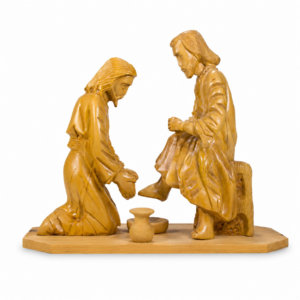 Hand carved olive wood Jesus Washing the Feet statue made in Bethlehem, depicting Christ humbly washing the disciples' feet, a meaningful Holy Land Christian sculpture for home décor and prayer.