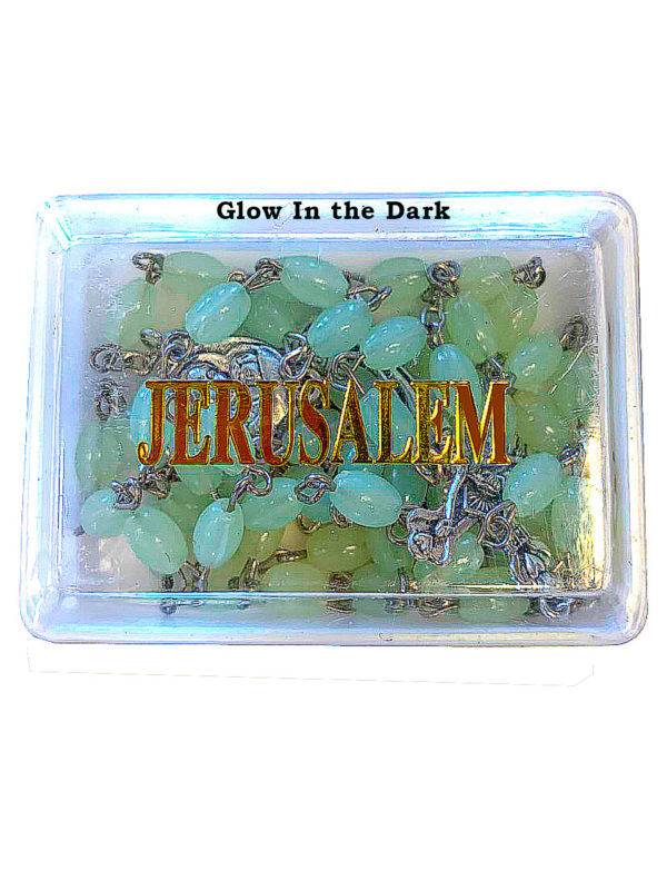 A glow in the dark Rosary inside of its box